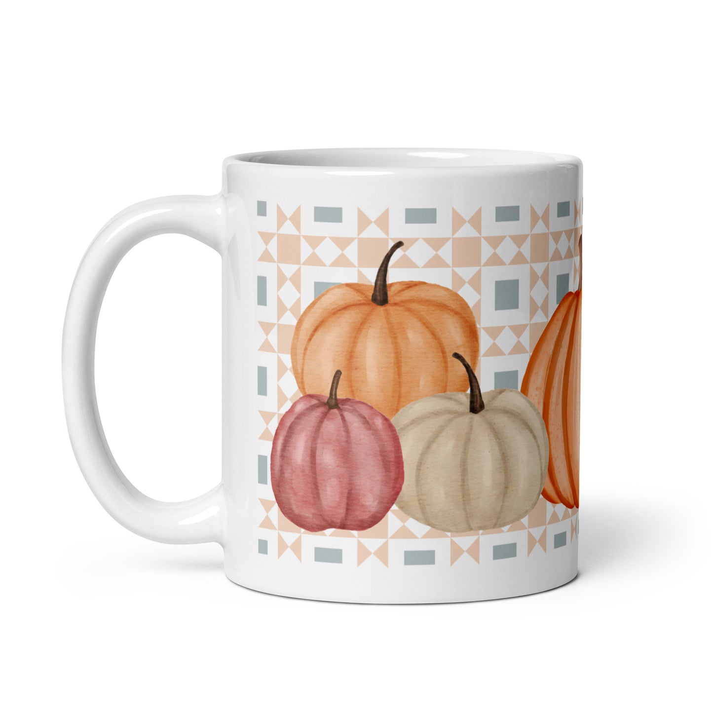 White mug with pumpkins and geometric pattern on a white background
