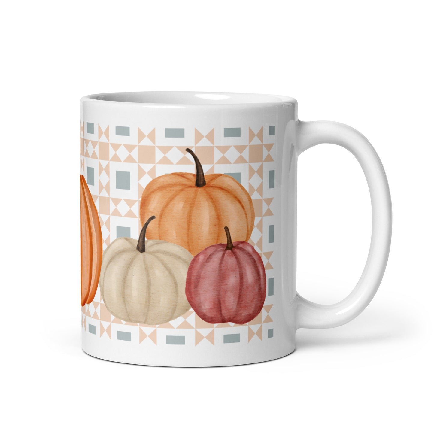White mug with pumpkins and geometric pattern on a white background