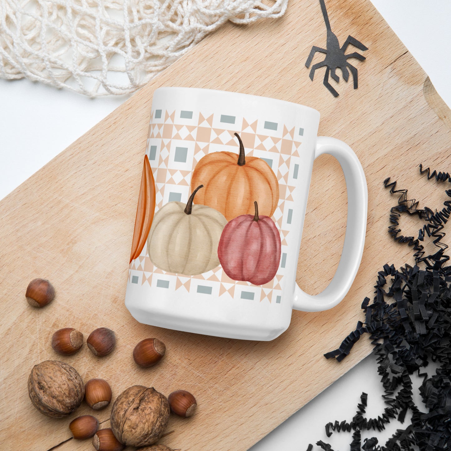 Glossy patchwork pumpkin mug with quilt pattern background – fall quilting coffee cup gift for sewists