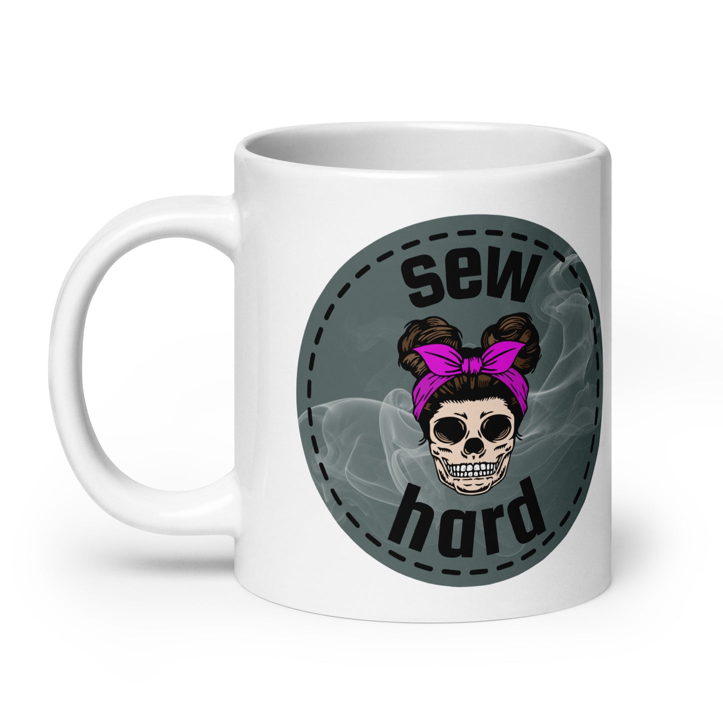 White ceramic mug with Sew Hard skull design featuring pigtail buns, pink bow, and smoky sage green background – sewing gift for quilters and sewists